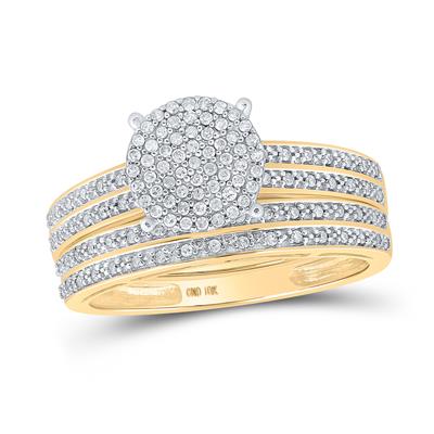 Sparkling round-cut diamond engagement ring with pave diamond band and matching wedding band in 10k yellow gold.