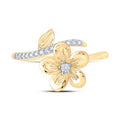 Gold ring featuring a delicate flower with a sparkling diamond center and diamond accents on the band.