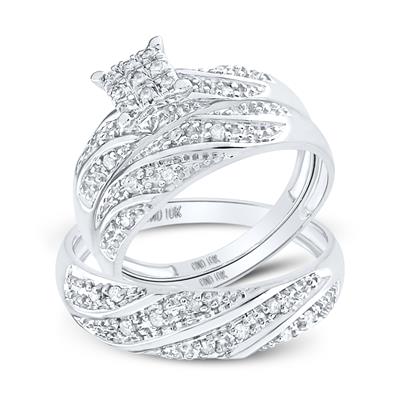White gold diamond engagement ring and wedding band set with a swirling pave diamond design.