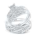 White gold diamond engagement ring and wedding band set with a swirling pave diamond design.