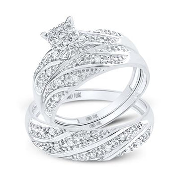 White gold diamond engagement ring and wedding band set with a swirling pave diamond design.