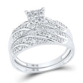 Sparkling diamond bridal set in white gold featuring a cluster of round diamonds in the center and pave-set diamond bands.