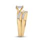 Gold ring featuring a sparkling marquise-cut diamond solitaire and pave-set diamond accents on the band.
